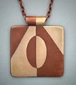 Bronze and copper inlay pendant; 1.75 x 1.50” with 26” adjustable copper chain