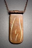 Copper and bronze Pendant,  “Life Forms Series #4”; Copper with bronze figure inlay measuring 2”h x 1”w and hangs on an antique copper adjustable length chain.