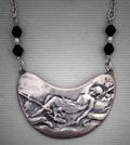 Silvery  Pendant "Aglow"; Art Nouveau-like pendant made with "White Satin" metal clay.  A woman resting in a hammock, measures 2 1/2" w x 1 1/4 h.