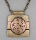 Pendant, Bronze/Copper/Steel Mokume Gane on Bronze/Copper backing; 1 7/8”  x 1 5/8”; 19” chain adjustable