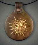 “Beginnings”;  Bronze and Copper circular Pendant with Mokume Gane detail, hanging on 18” Memory Wire. Pendant measures 2" h x 1 7/8" w.
