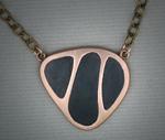 Bronze pendant with black grout
