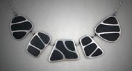 5 piece necklace of steel with black grout inlay.