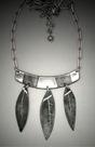 Steel 3 Leaf Necklace; L=  2 ½ ”   W= 2 1/4”  Steel necklace, horizontal bar from which hang 3 steel leaves.  18-20” adjustable steel chain.