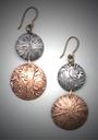 Bronze & Steel Earrings; 2 domed spheres with seed patterns.